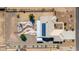 Bird's eye view of property with solar panels, white fencing, and xeriscaping at 10539 W Tamara Dr, Casa Grande, AZ 85193