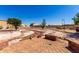 Paver patio surrounded by decorative rock landscaping in backyard at 10539 W Tamara Dr, Casa Grande, AZ 85193