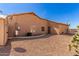 Gravel backyard with direct access to home and shed at 10539 W Tamara Dr, Casa Grande, AZ 85193