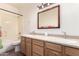 Stylish bathroom with double sinks, granite counters, and a shower-tub combination at 10539 W Tamara Dr, Casa Grande, AZ 85193