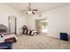 Bright bedroom features two twin beds, ceiling fan and sliding glass door to the backyard at 10539 W Tamara Dr, Casa Grande, AZ 85193