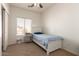 Cozy bedroom with natural light from the window and carpeted floors at 10539 W Tamara Dr, Casa Grande, AZ 85193