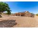 Back exterior view of property with a large backyard and shed at 10539 W Tamara Dr, Casa Grande, AZ 85193