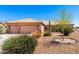Charming single-story home with xeriscaped front yard and a two-car garage at 10539 W Tamara Dr, Casa Grande, AZ 85193