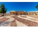 Exterior of home with back patio and desert landscaping at 10539 W Tamara Dr, Casa Grande, AZ 85193