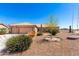 Charming single-story home with xeriscaped front yard and a two-car garage at 10539 W Tamara Dr, Casa Grande, AZ 85193