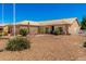 Beautiful desert home with xeriscaping, featuring a beige exterior and a tiled roof at 10539 W Tamara Dr, Casa Grande, AZ 85193