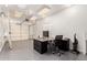 Well-organized garage space with an office area and epoxy coated floors at 10539 W Tamara Dr, Casa Grande, AZ 85193