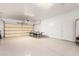 Spacious garage featuring a ping pong table and coated flooring at 10539 W Tamara Dr, Casa Grande, AZ 85193
