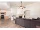 Spacious living room featuring modern floors, fireplace, and an open layout to the kitchen at 10539 W Tamara Dr, Casa Grande, AZ 85193