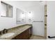 Bathroom vanity with a sink, granite countertop and dark wood cabinets at 1059 E Broadmor Dr, Tempe, AZ 85282
