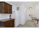 Laundry room with cabinetry, refrigerator, and hanging area at 1059 E Broadmor Dr, Tempe, AZ 85282