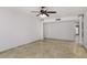 Open living room area with tile floors, columns, and neutral colored walls at 1059 E Broadmor Dr, Tempe, AZ 85282