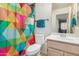 Bright bathroom with colorful shower curtain and vanity with white sink at 1060 W Dava Dr, Tempe, AZ 85283