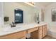 Primary bathroom with dual sinks, vanity, white countertop, tile flooring, and natural light at 1060 W Dava Dr, Tempe, AZ 85283