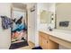 Bathroom offers a vanity with storage, a full mirror, a shower, and blue accents at 1060 W Dava Dr, Tempe, AZ 85283