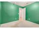 Neutral carpeted and freshly painted green bedroom offers a bright space with closet at 1060 W Dava Dr, Tempe, AZ 85283