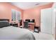 Bedroom boasts a modern desk setup with dual monitors, ideal for work or entertainment at 1060 W Dava Dr, Tempe, AZ 85283