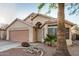 Beige single-Gathering home with arched entryway and desert landscaping at 1060 W Dava Dr, Tempe, AZ 85283