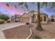 Single-story home with a two-car garage and desert landscaping at 1060 W Dava Dr, Tempe, AZ 85283