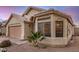 Charming single-story home featuring a two-car garage and desert landscaping at 1060 W Dava Dr, Tempe, AZ 85283