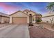 Charming single-story home featuring a two-car garage and well-maintained desert landscaping at 1060 W Dava Dr, Tempe, AZ 85283