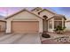 Charming single-story home with a two-car garage and beautiful desert landscaping at 1060 W Dava Dr, Tempe, AZ 85283