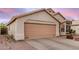 Single-story home with a two-car garage and low-maintenance landscaping at 1060 W Dava Dr, Tempe, AZ 85283