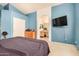 This blue-painted main bedroom is spacious and bright, offering a full ensuite bathroom at 1060 W Dava Dr, Tempe, AZ 85283