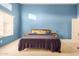 Bright bedroom featuring a large window, neutral carpet, and en-suite bathroom at 1060 W Dava Dr, Tempe, AZ 85283