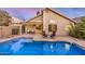 Backyard swimming pool with patio seating area in a private backyard setting at 1060 W Dava Dr, Tempe, AZ 85283