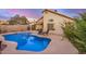 Backyard pool area features mature landscaping with a covered patio at 1060 W Dava Dr, Tempe, AZ 85283