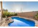 A private backyard swimming pool with block fence for added privacy at 1060 W Dava Dr, Tempe, AZ 85283