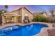 Inviting backyard pool and patio with mature landscaping and covered seating area at 1060 W Dava Dr, Tempe, AZ 85283