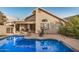 Relaxing backyard swimming pool with patio chairs and landscaped shrubbery at 1060 W Dava Dr, Tempe, AZ 85283