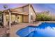 Backyard pool and patio area featuring chairs, a covered patio, and a landscaped yard at 1060 W Dava Dr, Tempe, AZ 85283