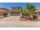 Charming home featuring a well-kept lawn, desert landscaping, and a two-car garage, offering curb appeal and convenience at 1142 E Mayfield Dr, San Tan Valley, AZ 85143