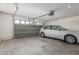 Spacious two-car garage with a modern sectional door and ample room for parking and storage at 1142 E Mayfield Dr, San Tan Valley, AZ 85143