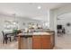 Bright kitchen with an open layout, stainless steel dishwasher, and a clear view to the dining and living areas at 1142 E Mayfield Dr, San Tan Valley, AZ 85143