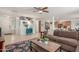 Open concept living room offering seamless flow to the kitchen and staircase featuring a comfortable seating area at 1142 E Mayfield Dr, San Tan Valley, AZ 85143
