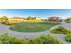 Community playground featuring a colorful play structure and shaded picnic area, surrounded by lush landscaping at 1142 E Mayfield Dr, San Tan Valley, AZ 85143