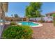 Enjoy a refreshing pool surrounded by desert landscape, perfect for relaxation and outdoor fun at 1142 E Mayfield Dr, San Tan Valley, AZ 85143
