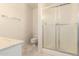 Functional bathroom features a toilet, shower, and vanity at 11627 S Iroquois Dr, Phoenix, AZ 85044