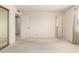 Standard bedroom featuring a large closet, neutral carpet, and ample natural light at 11627 S Iroquois Dr, Phoenix, AZ 85044