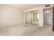 Bedroom featuring carpet, a closet, and neutral wall color at 11627 S Iroquois Dr, Phoenix, AZ 85044