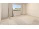 Bright bedroom with neutral carpet, and large windows offering ample natural light at 11627 S Iroquois Dr, Phoenix, AZ 85044