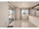 Open dining area with tile flooring and natural light, adjacent to the kitchen at 11627 S Iroquois Dr, Phoenix, AZ 85044
