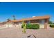 Charming single-story home featuring desert landscaping, brick accents, and a well-maintained front yard at 11627 S Iroquois Dr, Phoenix, AZ 85044