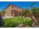 Attractive backyard featuring a covered patio, green lawn, and tasteful landscaping, perfect for outdoor enjoyment at 12029 W Overlin Ln, Avondale, AZ 85323