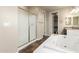Bathroom featuring a glass shower, soaking tub, and double vanities at 12029 W Overlin Ln, Avondale, AZ 85323